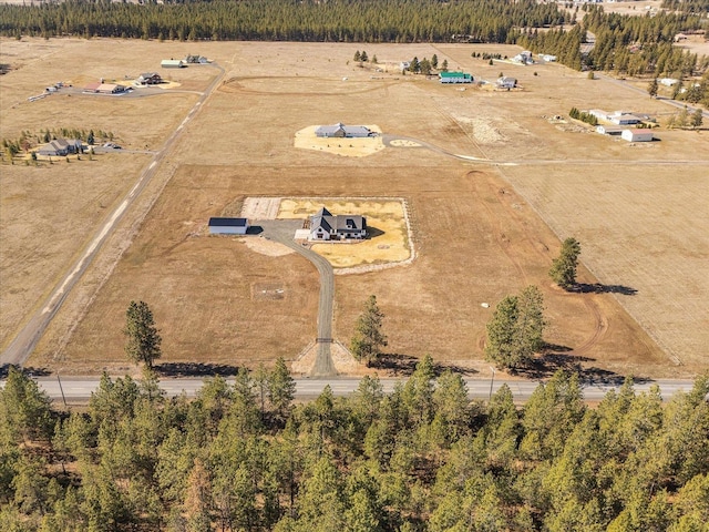 birds eye view of property featuring a rural view