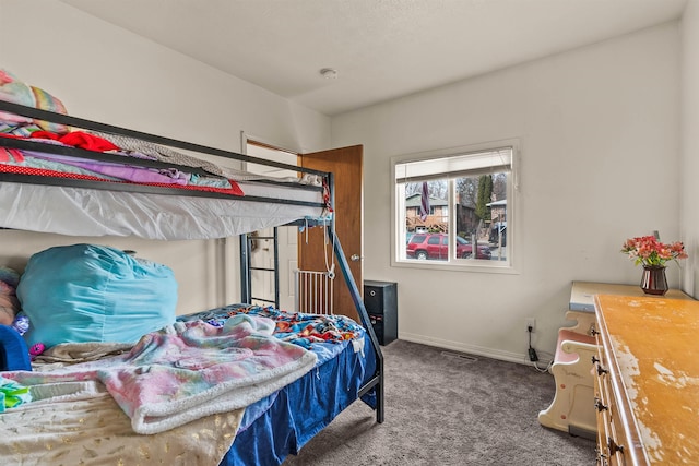 bedroom with baseboards and carpet flooring