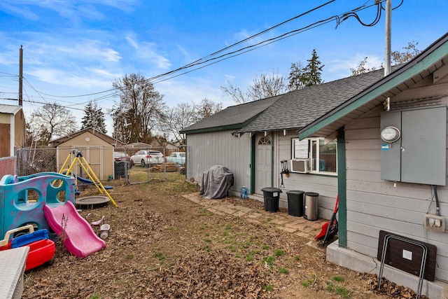 view of yard featuring a playground and fence