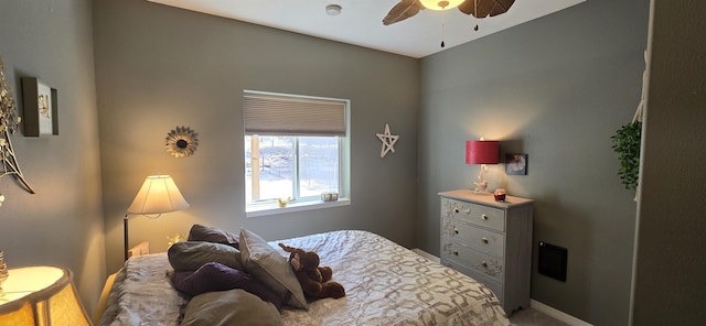 bedroom featuring baseboards and ceiling fan