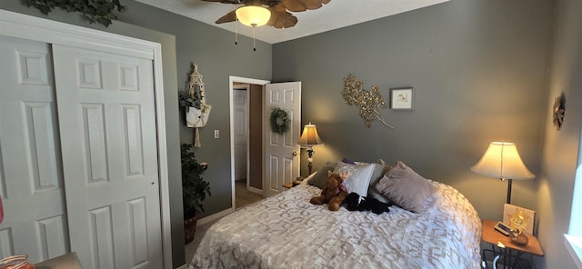 bedroom with ceiling fan, baseboards, and carpet floors