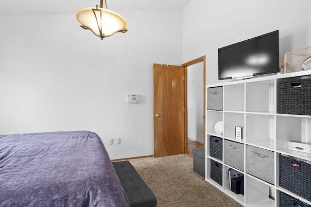 carpeted bedroom with baseboards