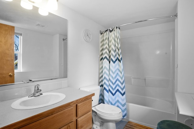 bathroom featuring visible vents, toilet, vanity, and shower / bathtub combination with curtain