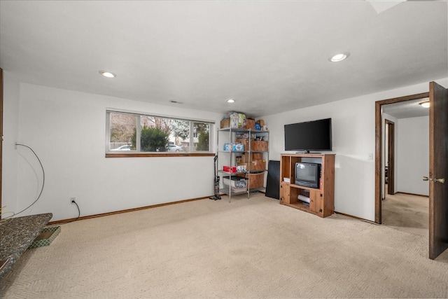 interior space featuring light carpet, recessed lighting, and baseboards