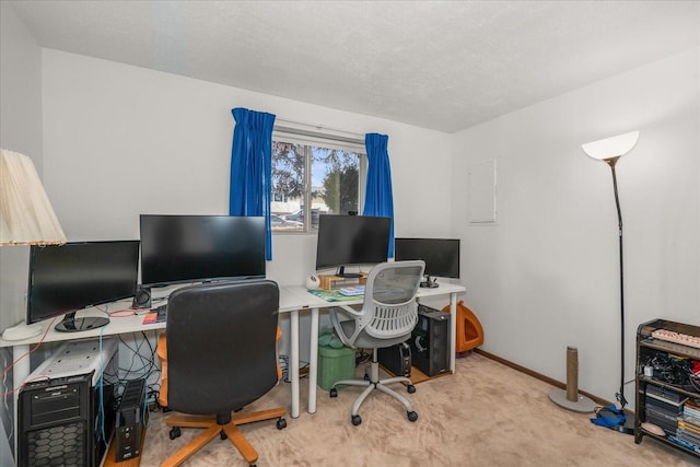 carpeted home office with baseboards