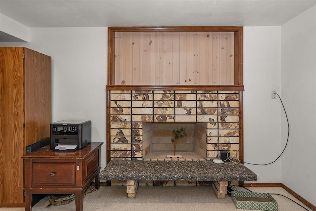 interior details featuring a fireplace and baseboards