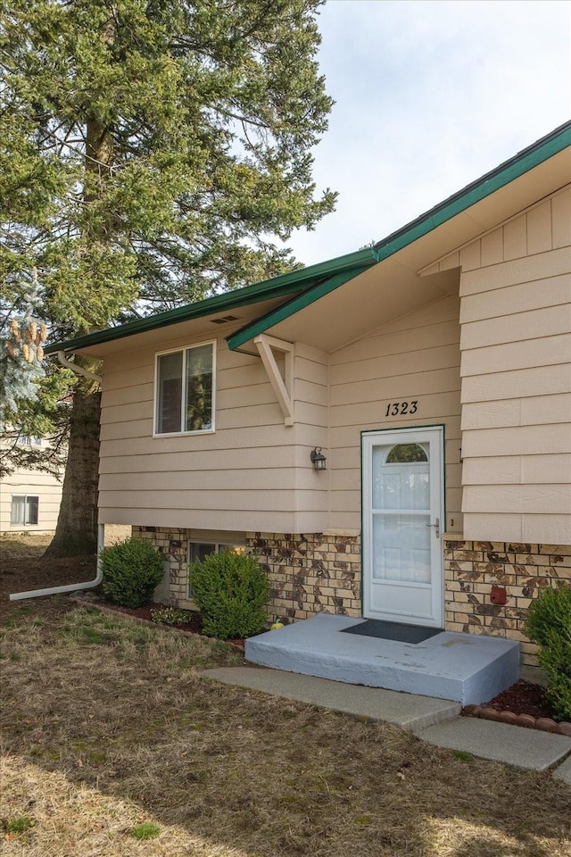 view of exterior entry with stone siding