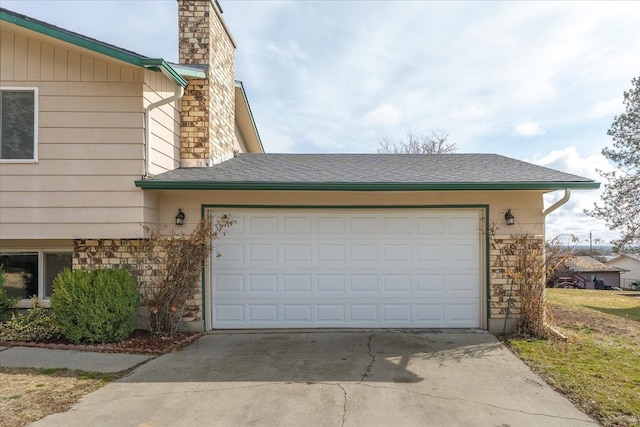 garage with concrete driveway