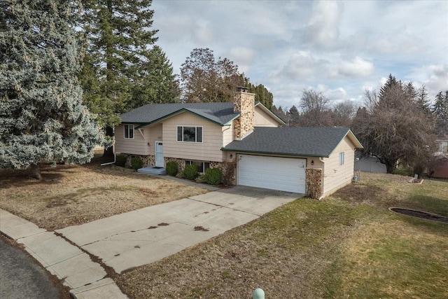 view of front of property with a front yard, an attached garage, concrete driveway, and a chimney