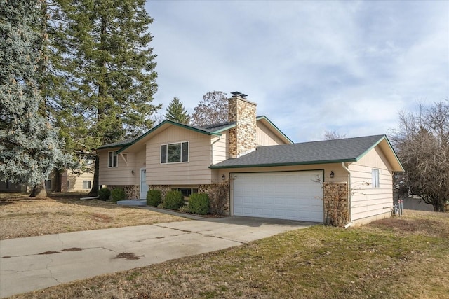 raised ranch featuring a front lawn, concrete driveway, roof with shingles, a chimney, and a garage