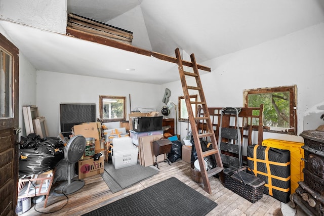 misc room featuring wood finished floors and vaulted ceiling