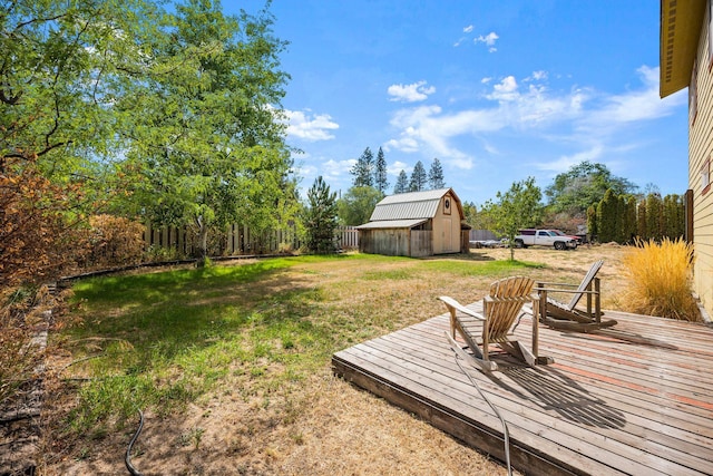 view of yard with an outbuilding and a wooden deck