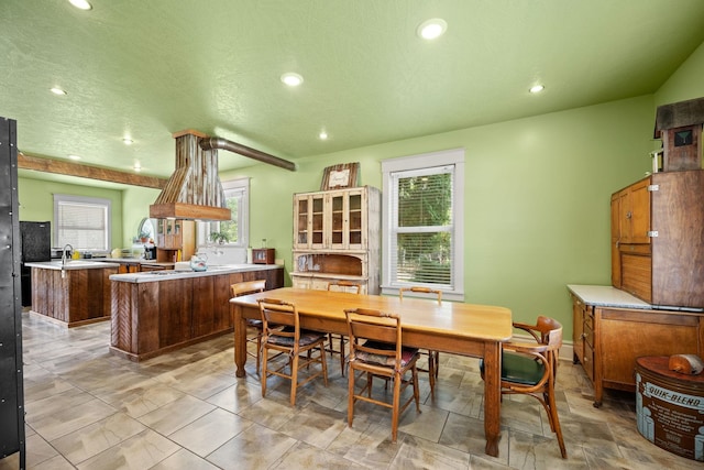 dining space featuring recessed lighting and a textured ceiling