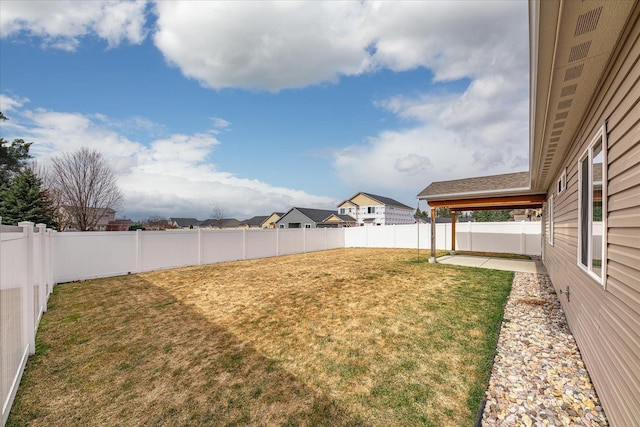 view of yard with a patio and a fenced backyard