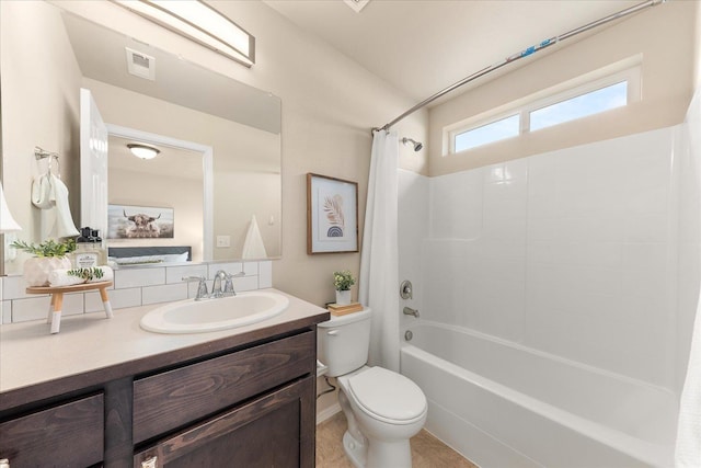 bathroom with visible vents, toilet, shower / tub combo with curtain, and vanity