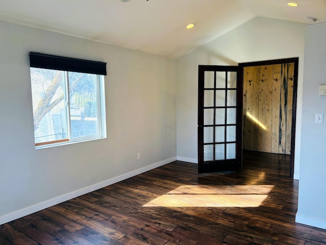 unfurnished room with hardwood / wood-style floors, vaulted ceiling, recessed lighting, and baseboards