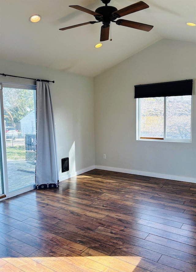 spare room with baseboards, wood-type flooring, and lofted ceiling