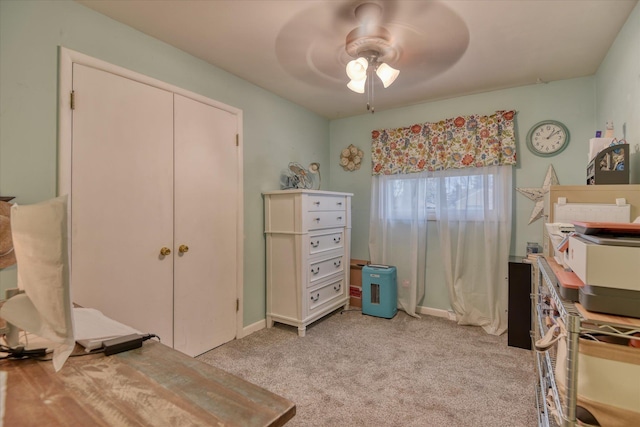 bedroom with a closet, light colored carpet, and ceiling fan