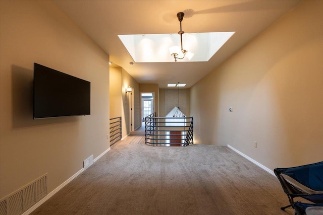 interior space with carpet, visible vents, and baseboards