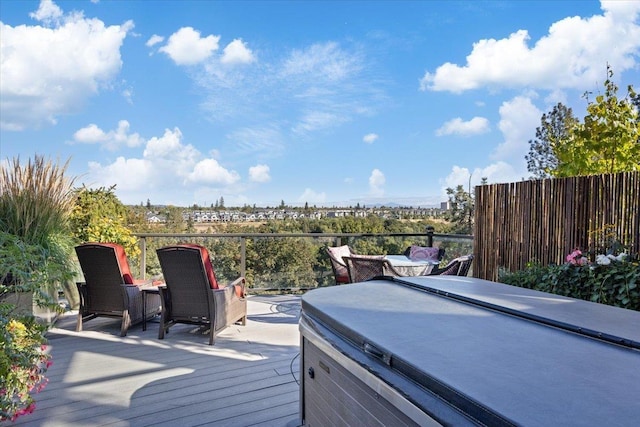 wooden terrace featuring a hot tub