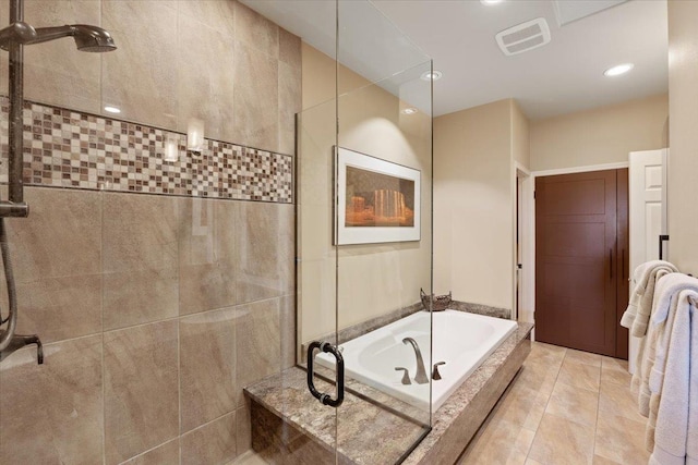 bathroom with visible vents, walk in shower, a garden tub, recessed lighting, and tile patterned floors