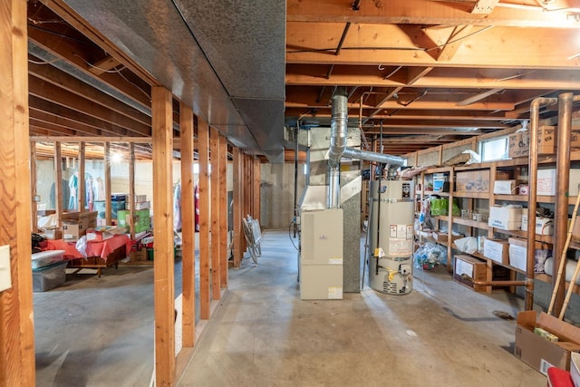 basement featuring gas water heater and heating unit