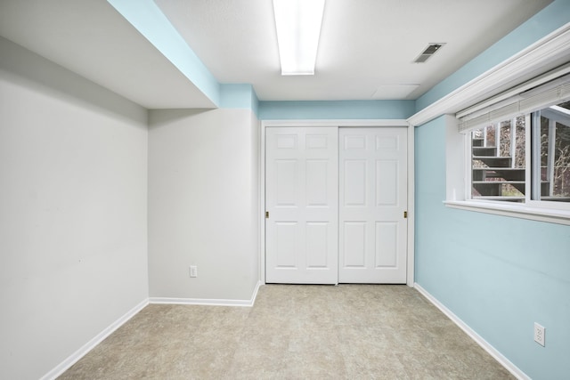 unfurnished bedroom featuring visible vents, baseboards, and carpet flooring