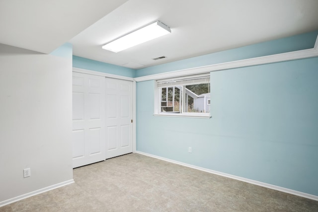 unfurnished room featuring visible vents and baseboards