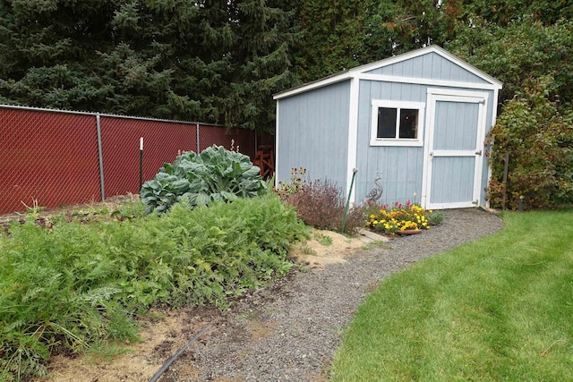 view of shed featuring fence