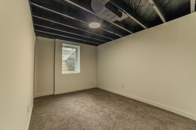 below grade area with baseboards and carpet floors