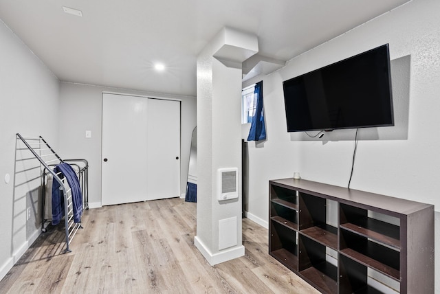 interior space with wood finished floors and baseboards