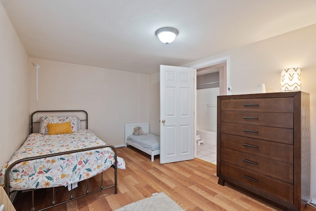 bedroom with light wood finished floors