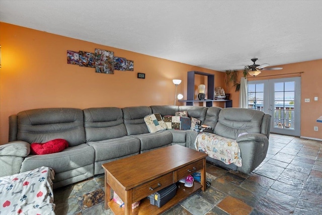 living room with stone tile flooring, french doors, a textured ceiling, and a ceiling fan