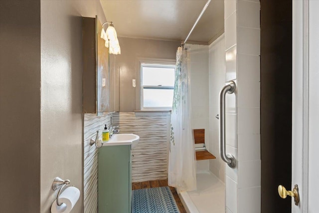 bathroom with vanity and a shower stall