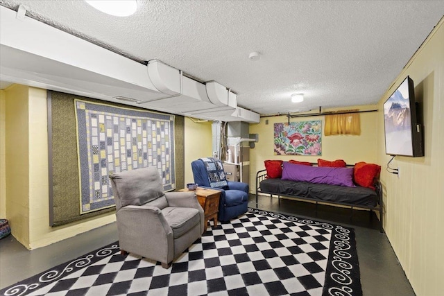 bedroom featuring a textured ceiling and concrete flooring