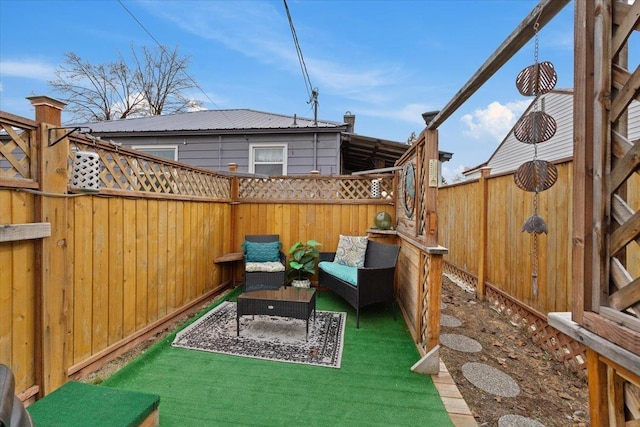 view of patio / terrace featuring an outdoor living space and a fenced backyard