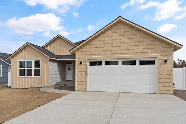 ranch-style house featuring board and batten siding, fence, roof with shingles, driveway, and an attached garage