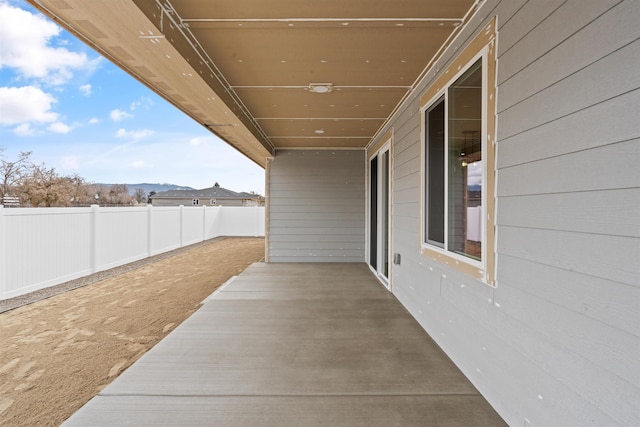 view of patio / terrace featuring fence