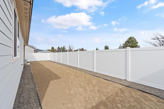 view of yard with a patio and a fenced backyard