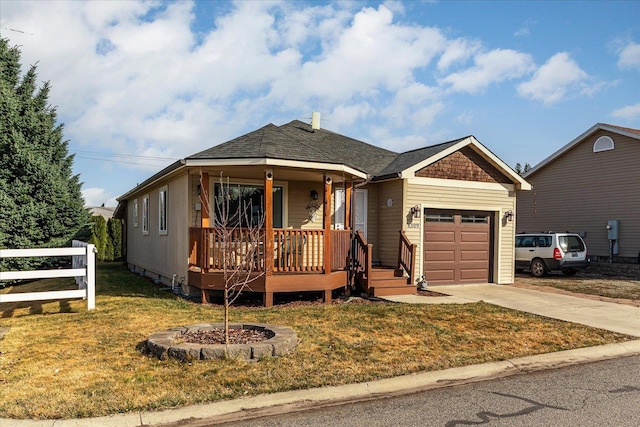 view of front facade with a front lawn, fence, concrete driveway, a garage, and crawl space