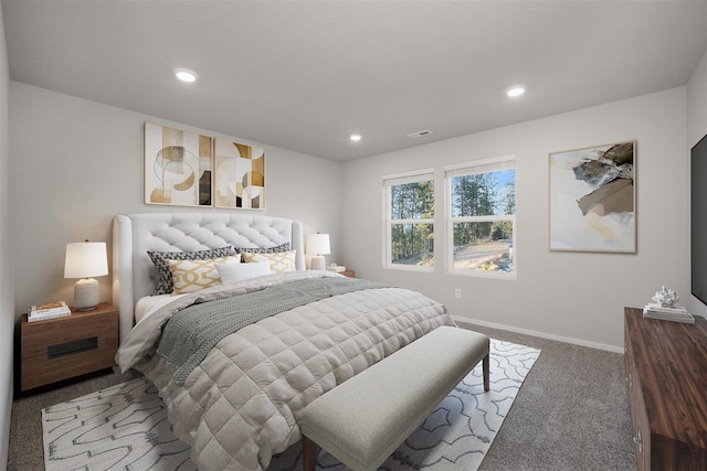 carpeted bedroom with visible vents, recessed lighting, and baseboards