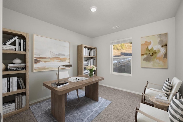 office with visible vents, baseboards, and carpet