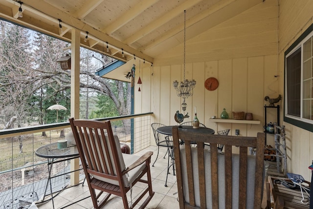 sunroom with lofted ceiling