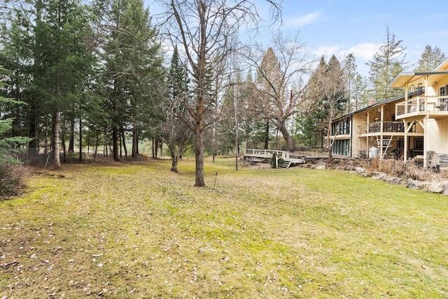 view of yard with a wooden deck