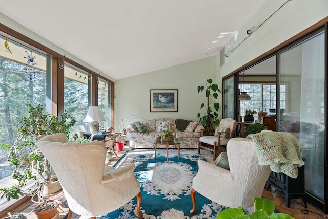 living room with a wealth of natural light and lofted ceiling