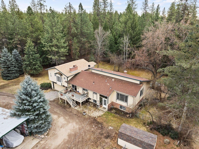 drone / aerial view featuring a view of trees