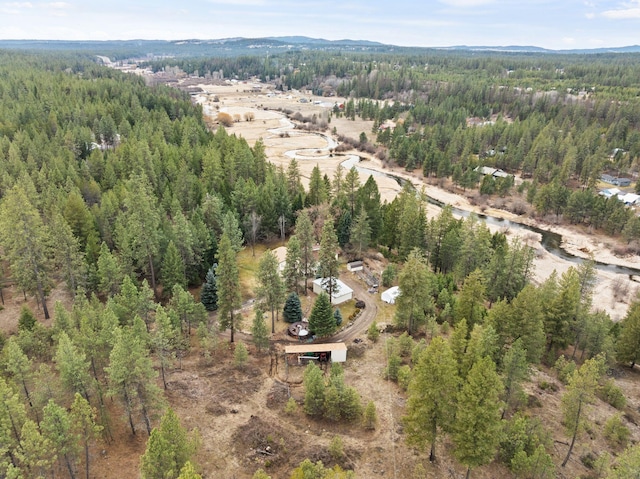 bird's eye view with a mountain view and a wooded view