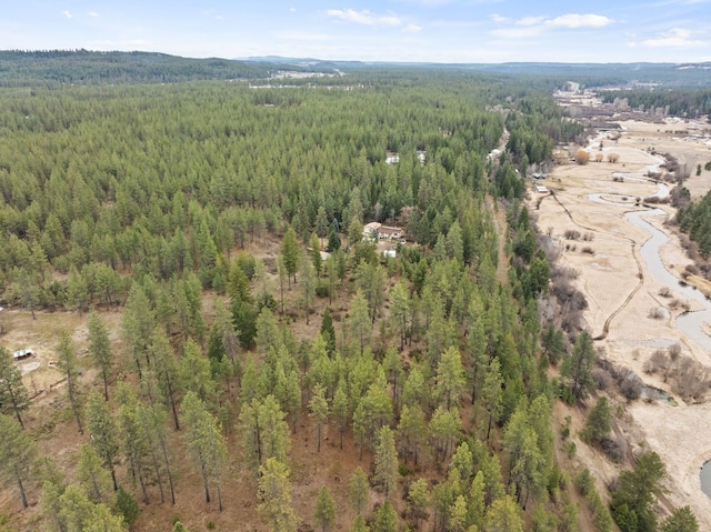 bird's eye view featuring a view of trees