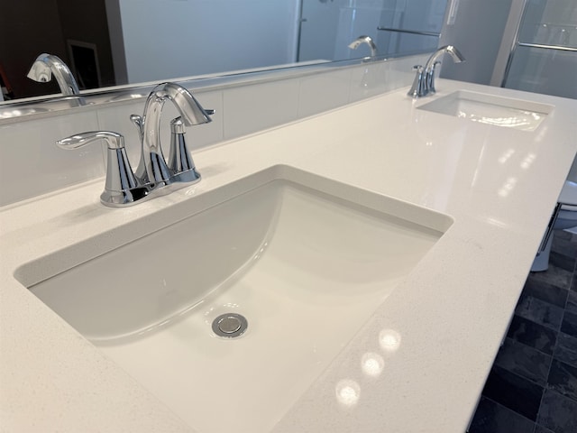 interior details featuring double vanity and a sink