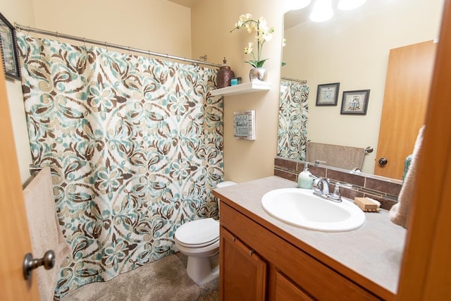 bathroom featuring tasteful backsplash, curtained shower, toilet, and vanity